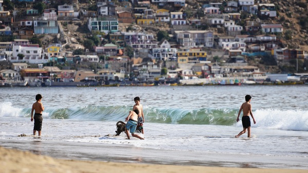 Kids playing on the beach near Puerto Montt