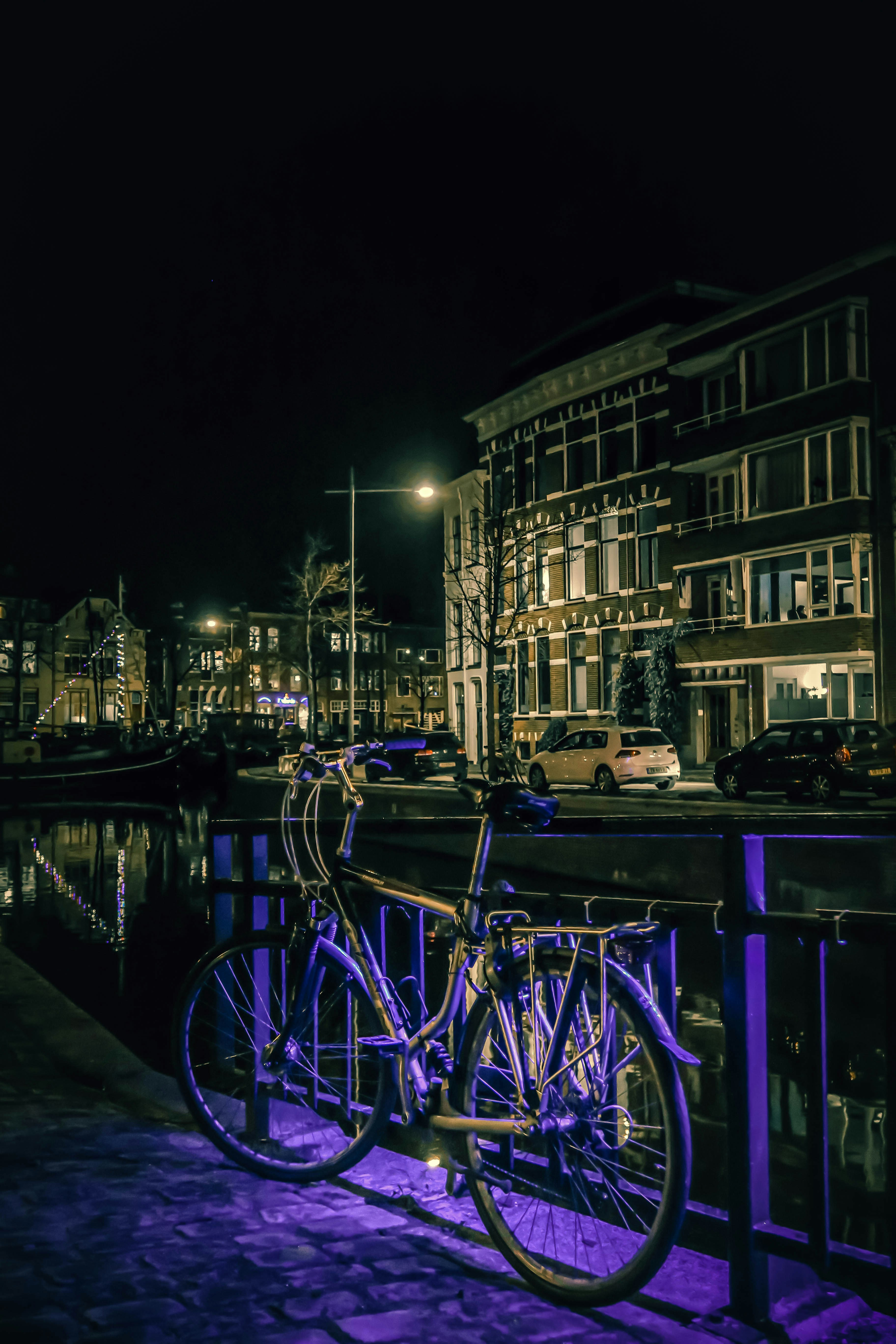 A bike parkes nearby the canal in The Netherlands - Groningen