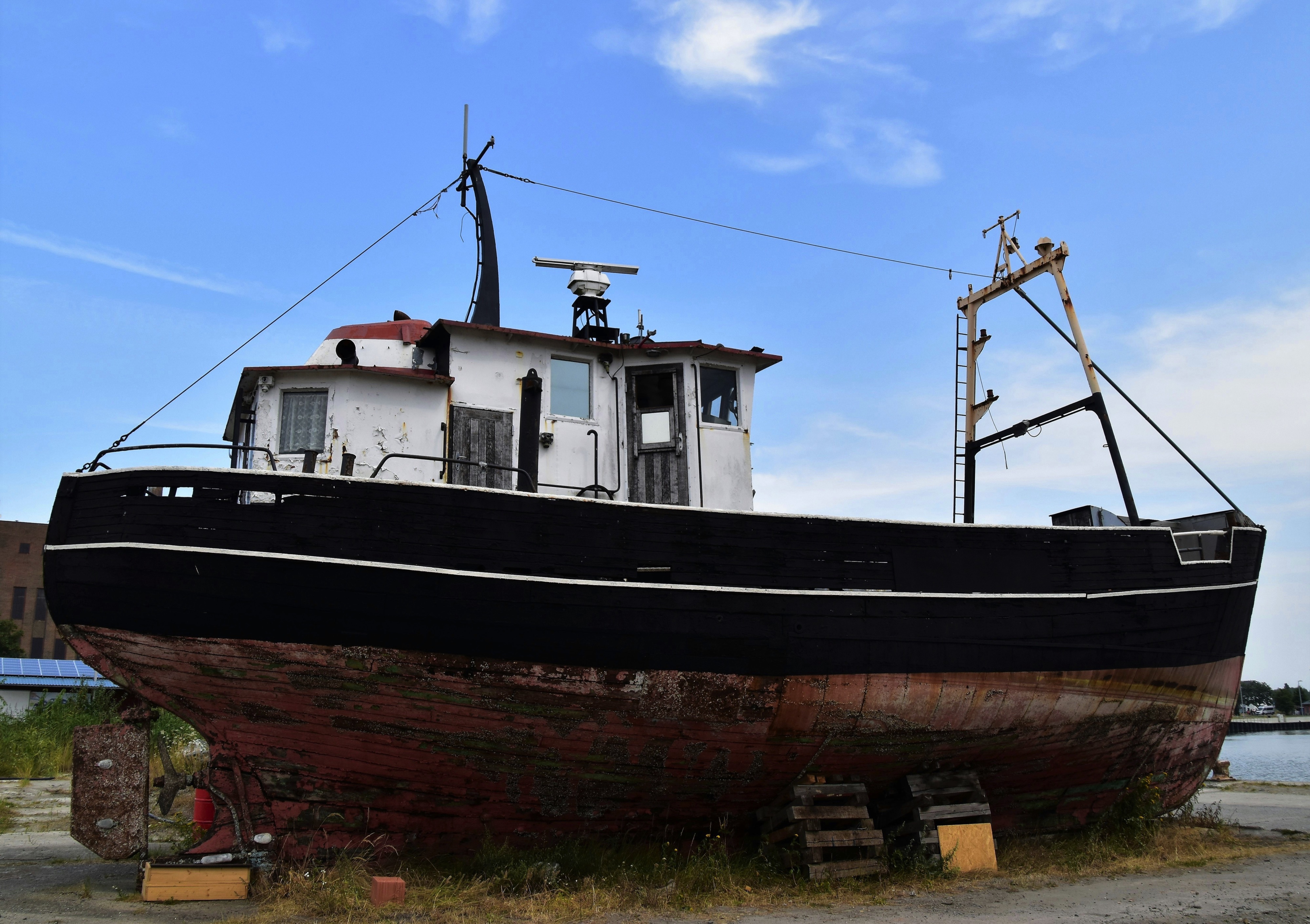 Old rusty ship on Land near the sea, Peenemünde, Germany