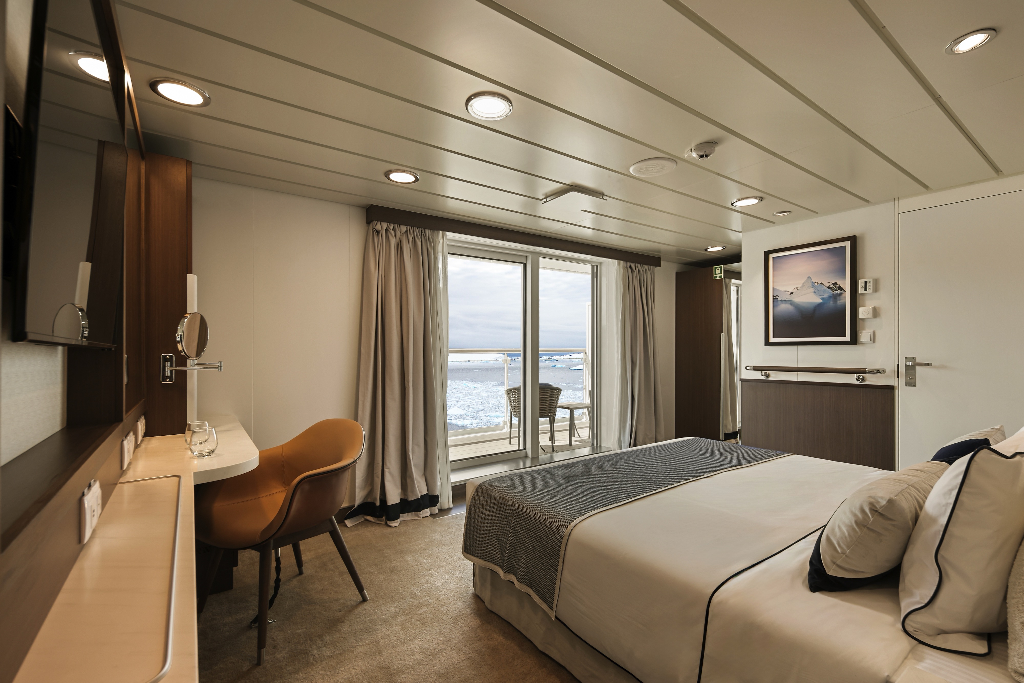 AE Expeditions Douglas Mawson Balcony Stateroom Superior Bedroom 1 ©AE Expeditions.jpg